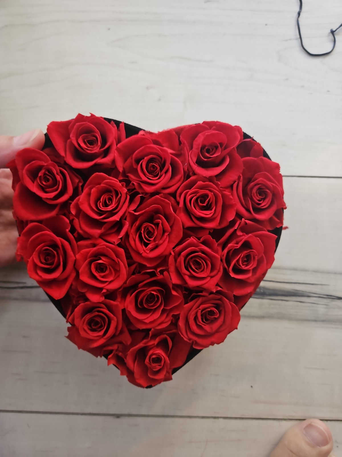 Eternal Rose heart-shaped arrangement containing 16 preserved red roses