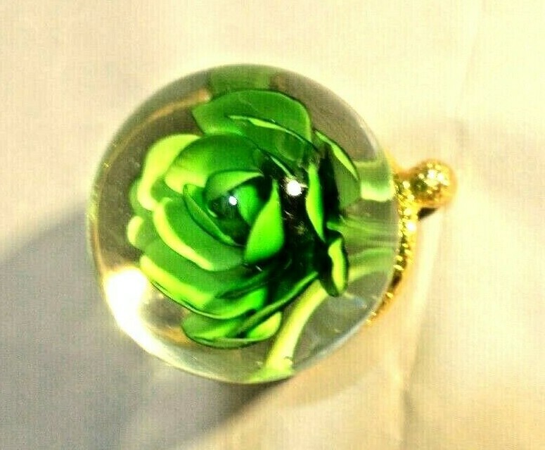 Green flower in glass on gold stand home – office decor, 3″ tall X 4″