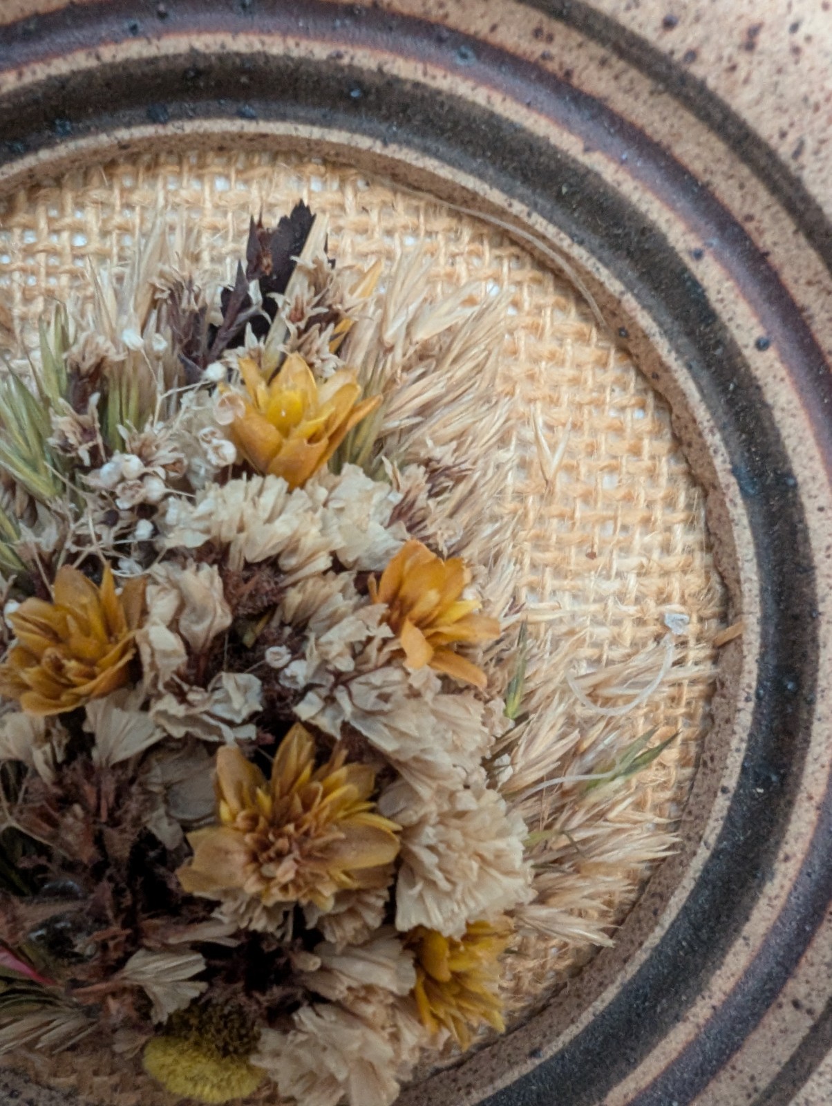 Dried flowers wall hanging round pottery circle speckled floral art boho fall