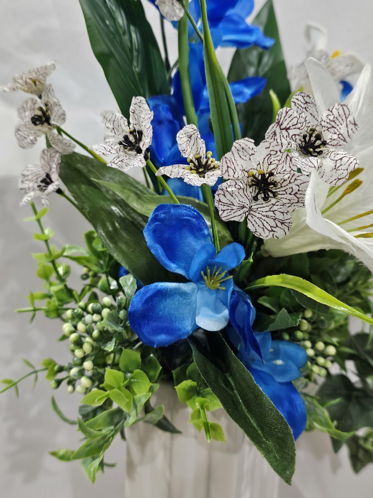 Blue with White Lilies Flower Arrangement Lush green & white ceramic vase