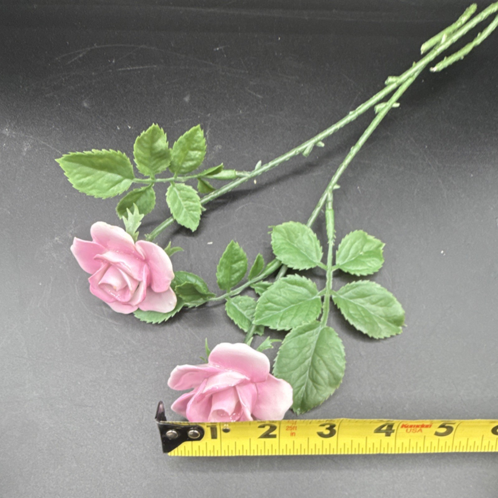 Porcelain flowers, pink roses with plastic stems and leaves