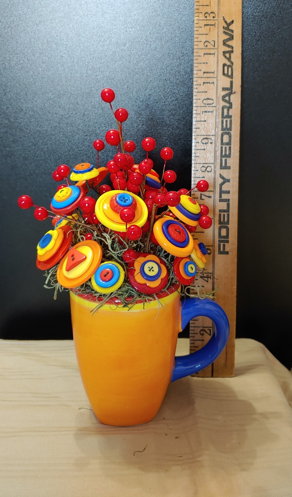 Bright Button Bouquet in Orange Coffee Mug. Red, orange, yellow. fun and playful
