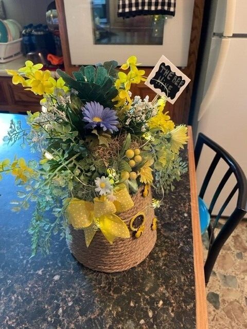 Hand made bee hive flower, with bees that light up, battery is included.