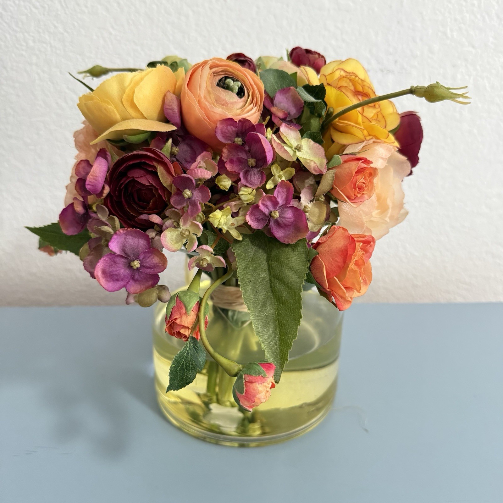 Beautiful Flower Arrangement in Glass Vase with Faux Water.