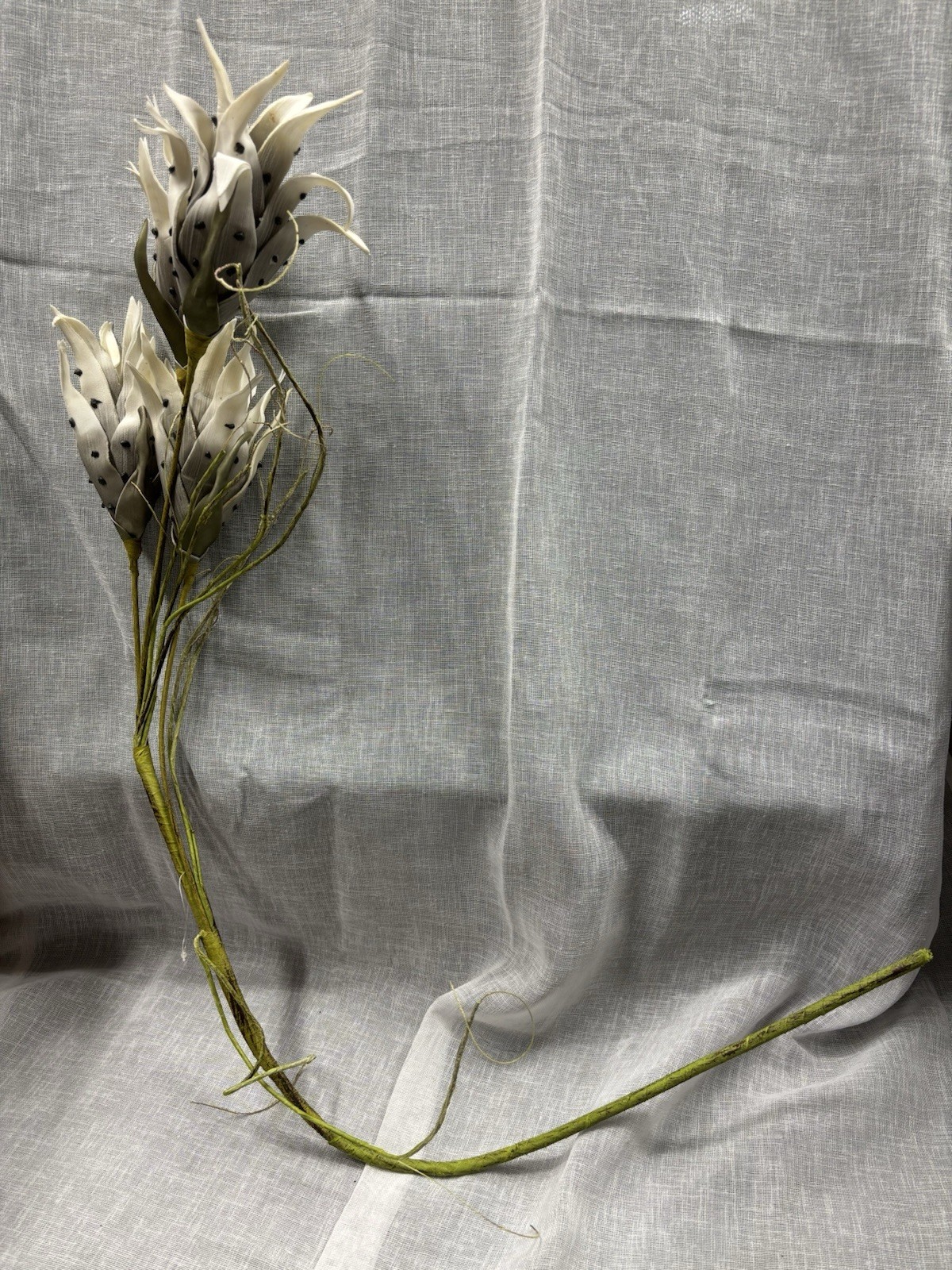 Artificial Flowers Off White and Black Spots with Green Leaves