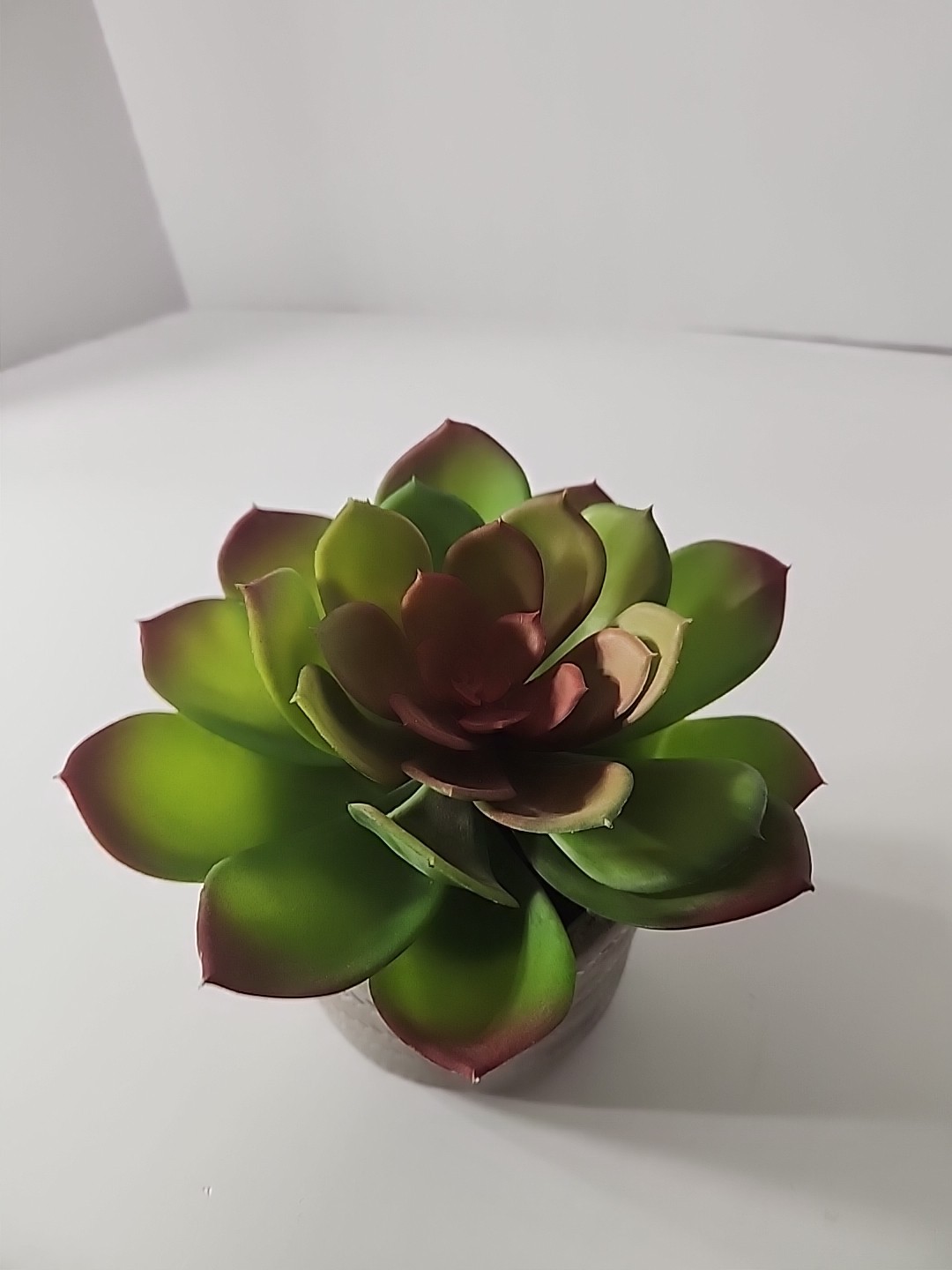 7.5 Inch Artificial House Plant In Decorative Stone Pot.
