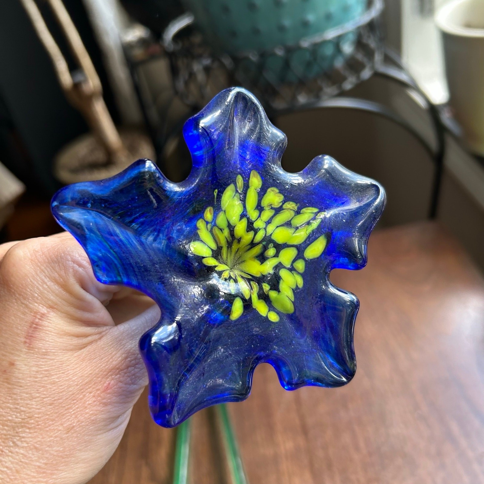 Handcrafted blue and yellow glass flower sculptures long green stems