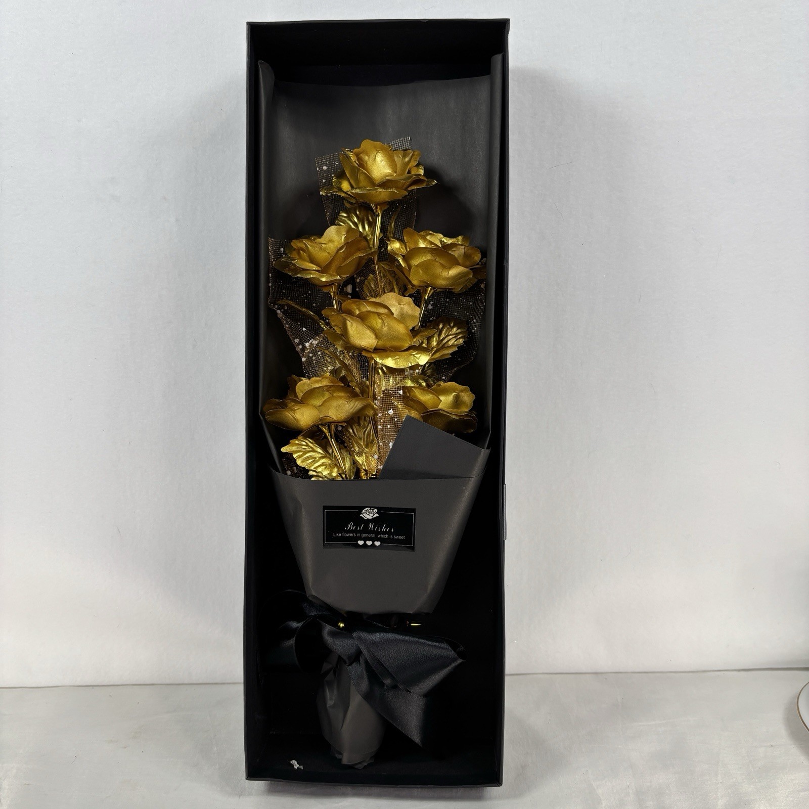 Gold-plated artificial rose bouquet in a black gift box