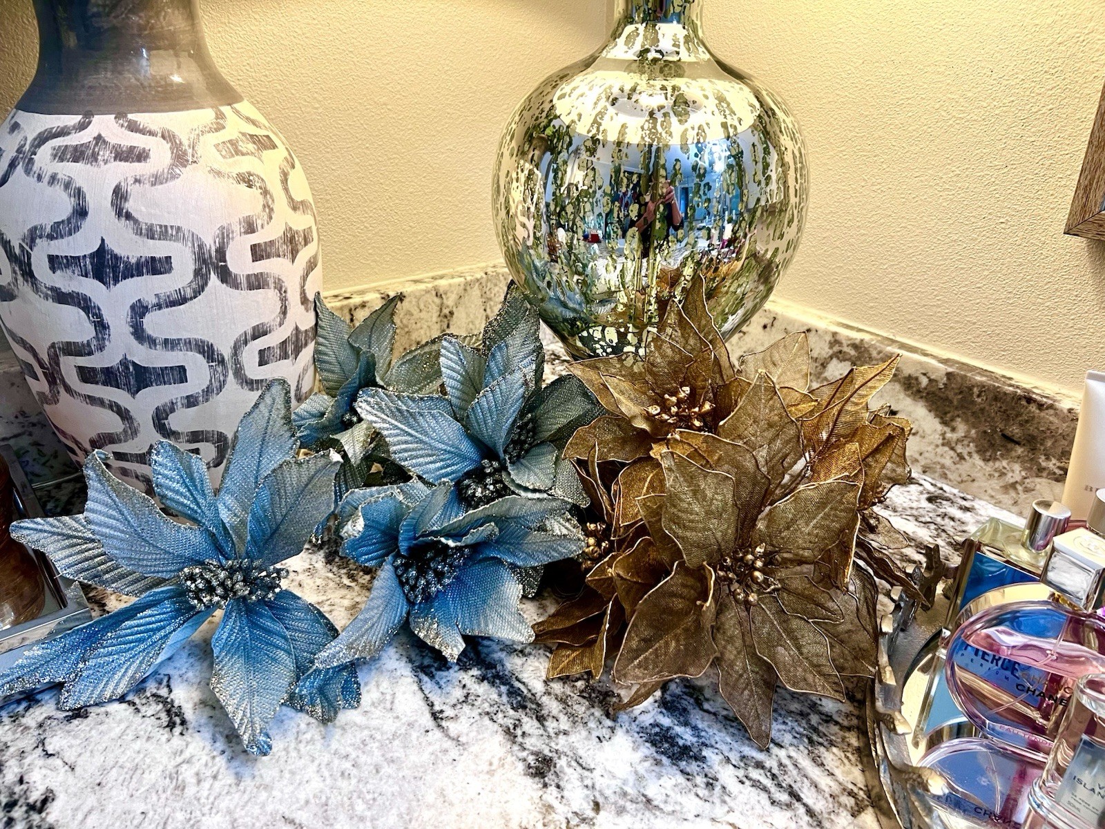 poinsettia flowers in a metallic Blue & silver used as decorations for Christmas