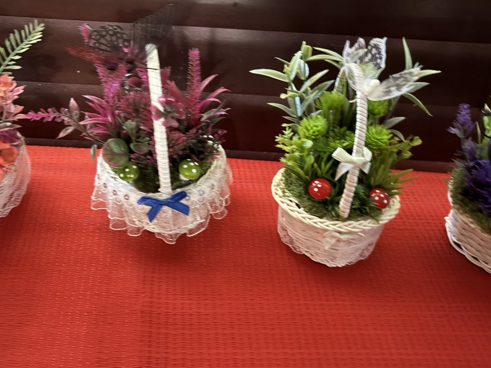 Artificial Floral Arrangement in White Wicker Baskets, Butterfly Accent