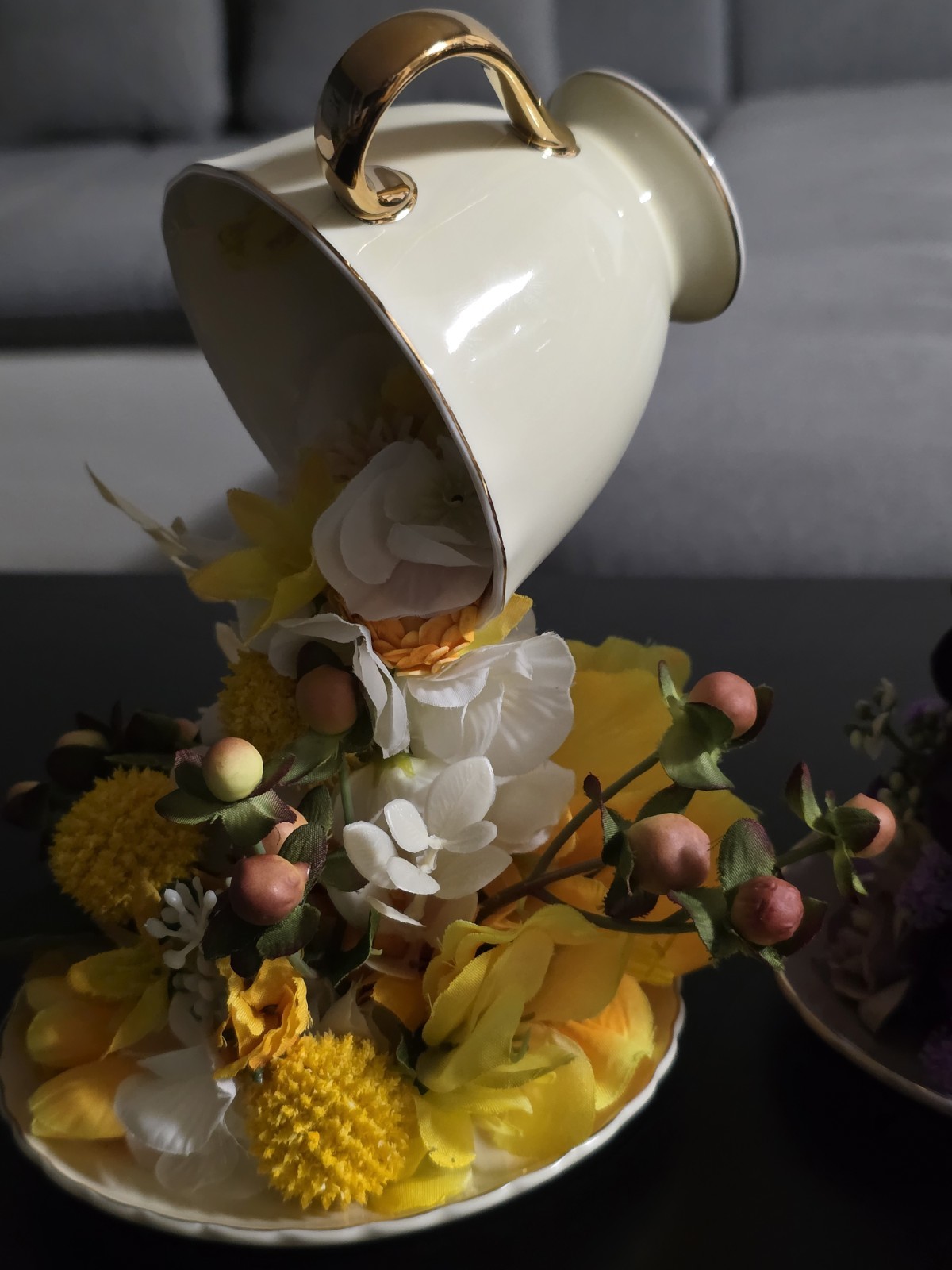 Floating Tea Cup Decorated With Faux Flowers Arrangement