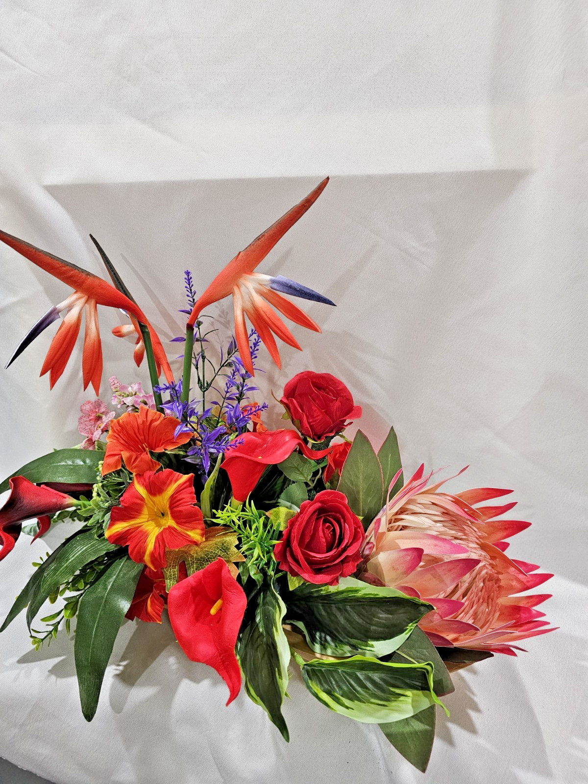 Bright Colors in this Artificial Tropical arrangement, Birds of Paradise etc.