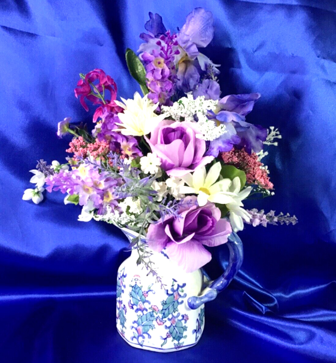 Beautiful Leaf Design Ceramic Pitcher with a Multicolor Floral Arrangement