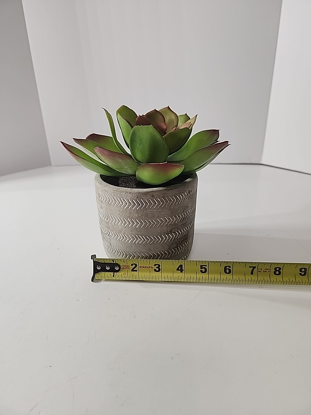 7.5 Inch Artificial House Plant In Decorative Stone Pot.