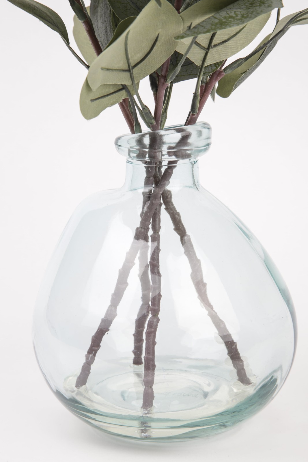 Artificial Green Eucalyptus Leaf Stems in Large Clear Blown Glass Vase