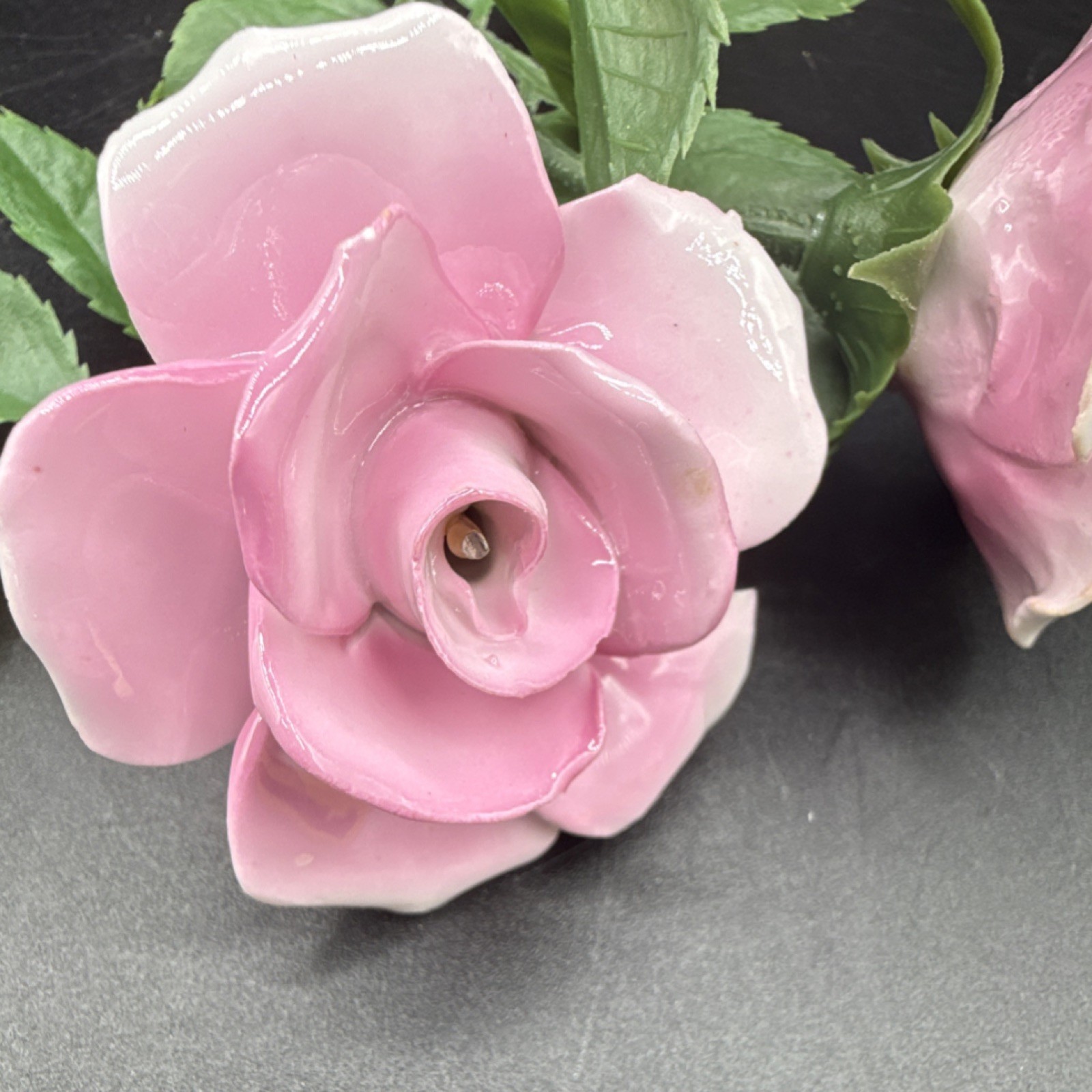 Porcelain flowers, pink roses with plastic stems and leaves