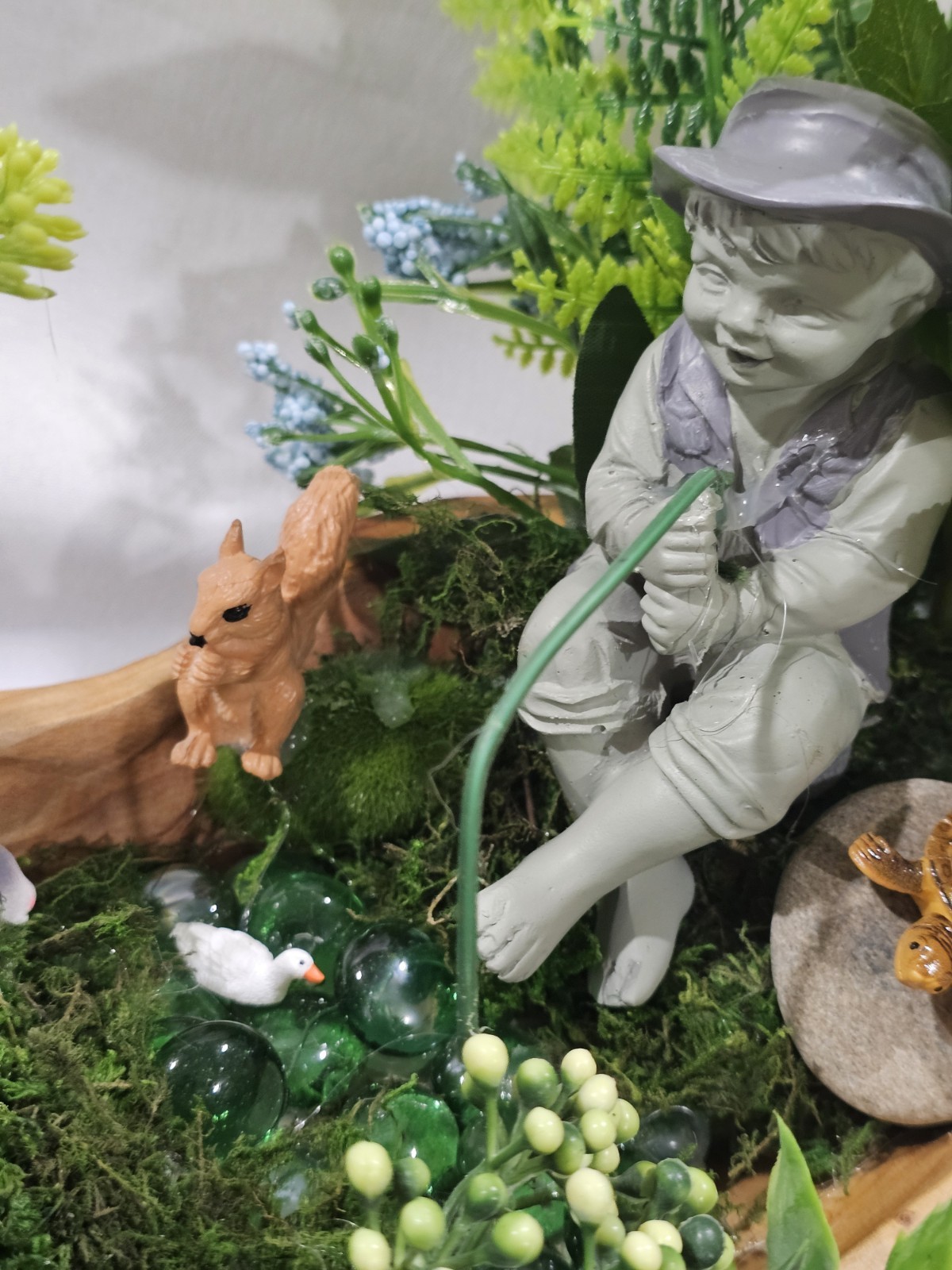 Artifical Flower Arramgement in woods, Boy Fishing Deer, Turtle Duck