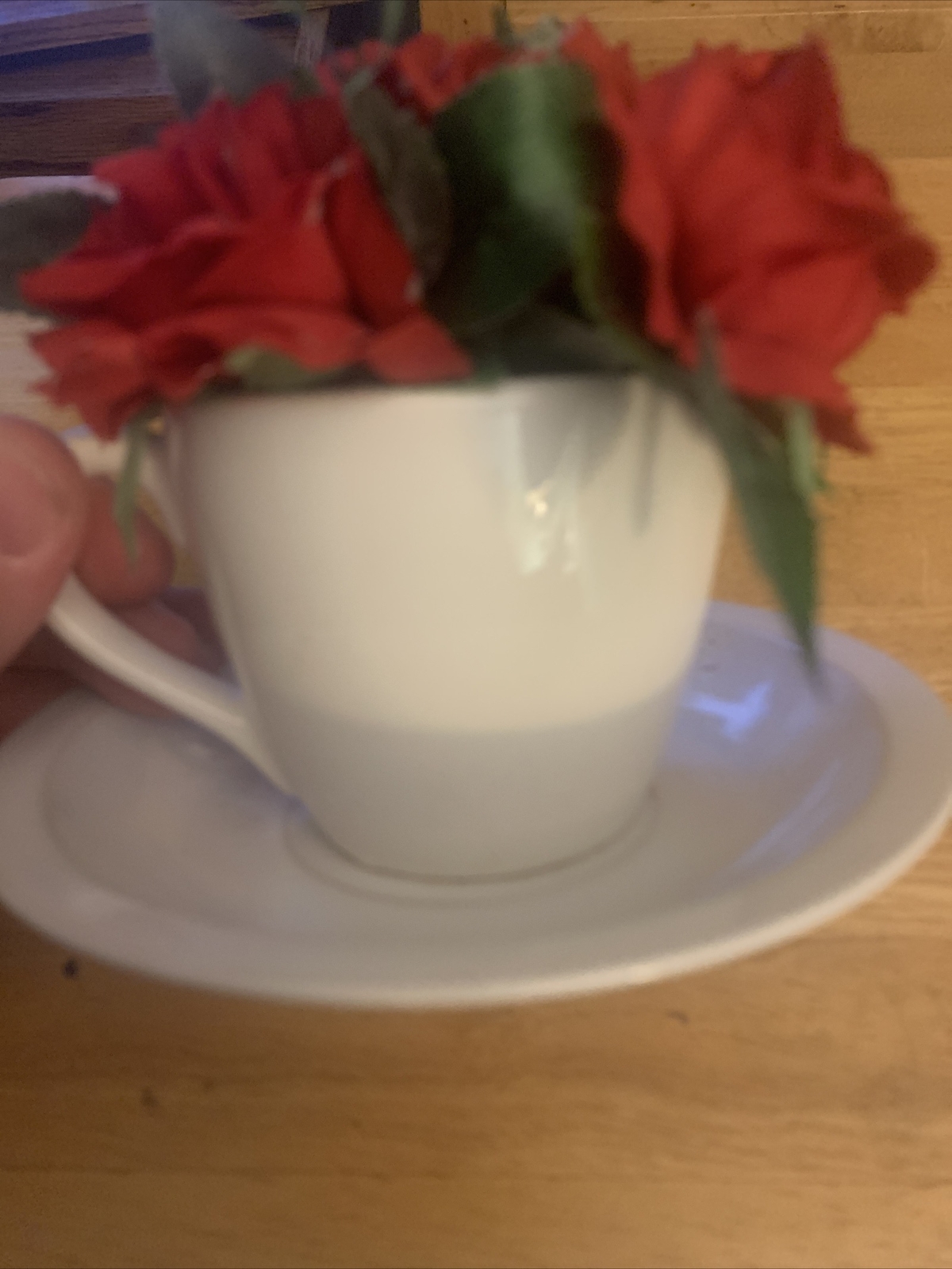 Artificial Red Flowers in Tea Cup and Saucer