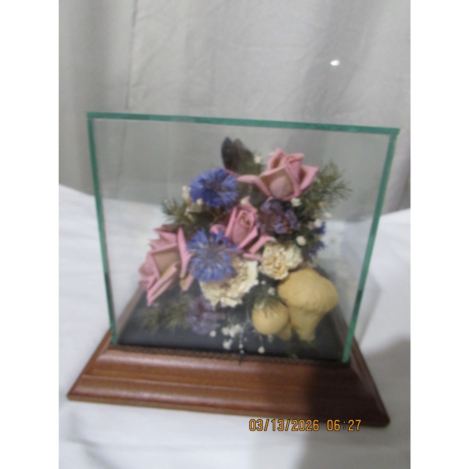Vintage dried flower arrangement in glass with wood base butterfly mushrooms
