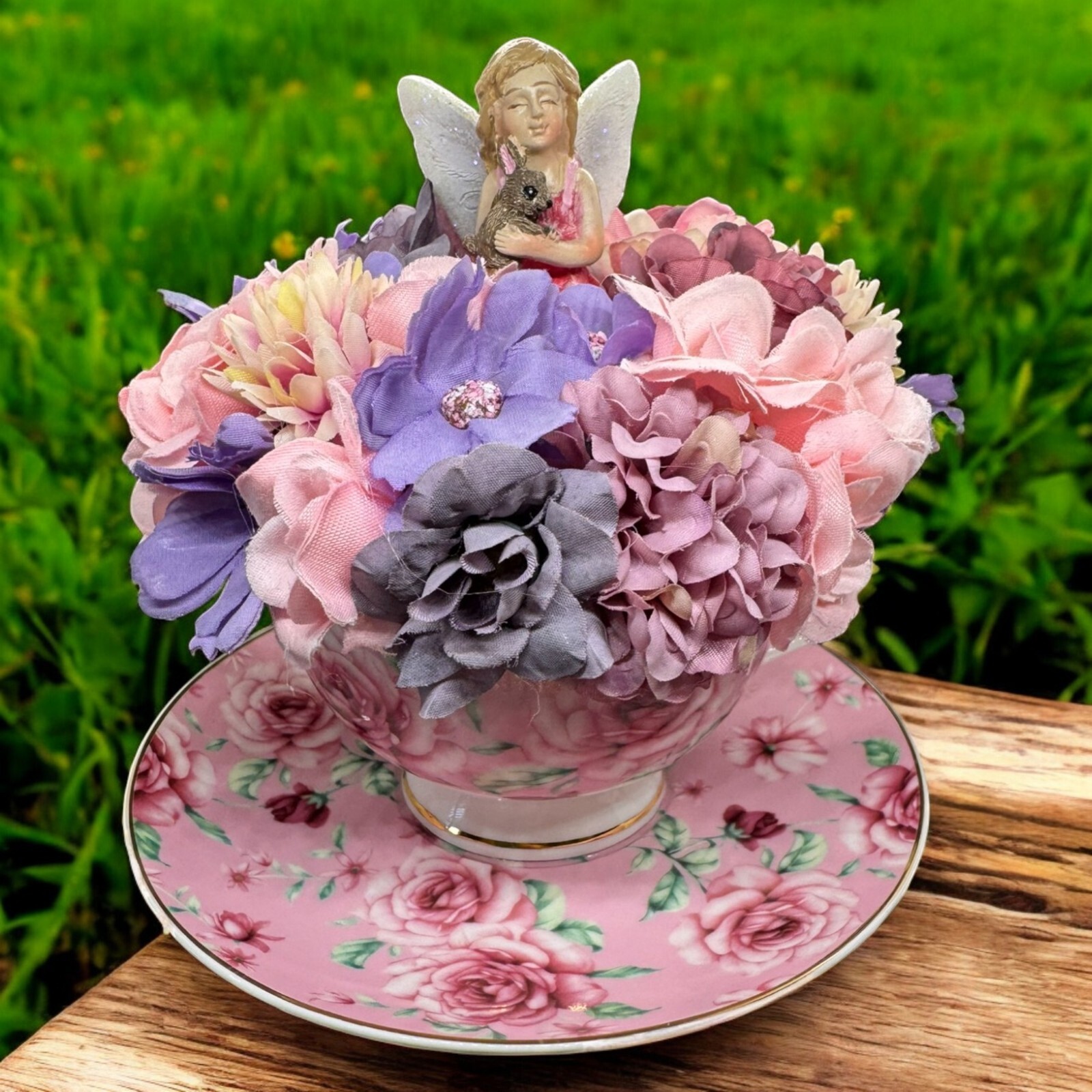 Pink Teacup Flower arrangement With Fairy