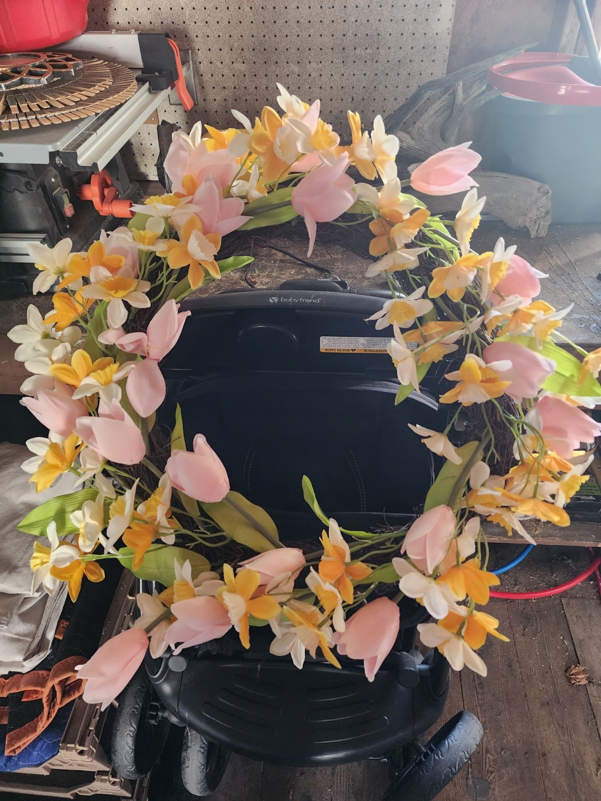 Artifical flower wreath with pink, yellow and white flowers