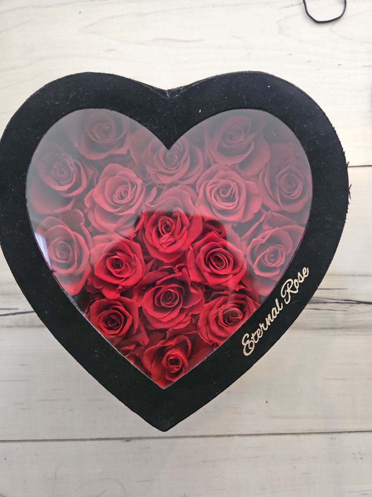 Eternal Rose heart-shaped arrangement containing 16 preserved red roses