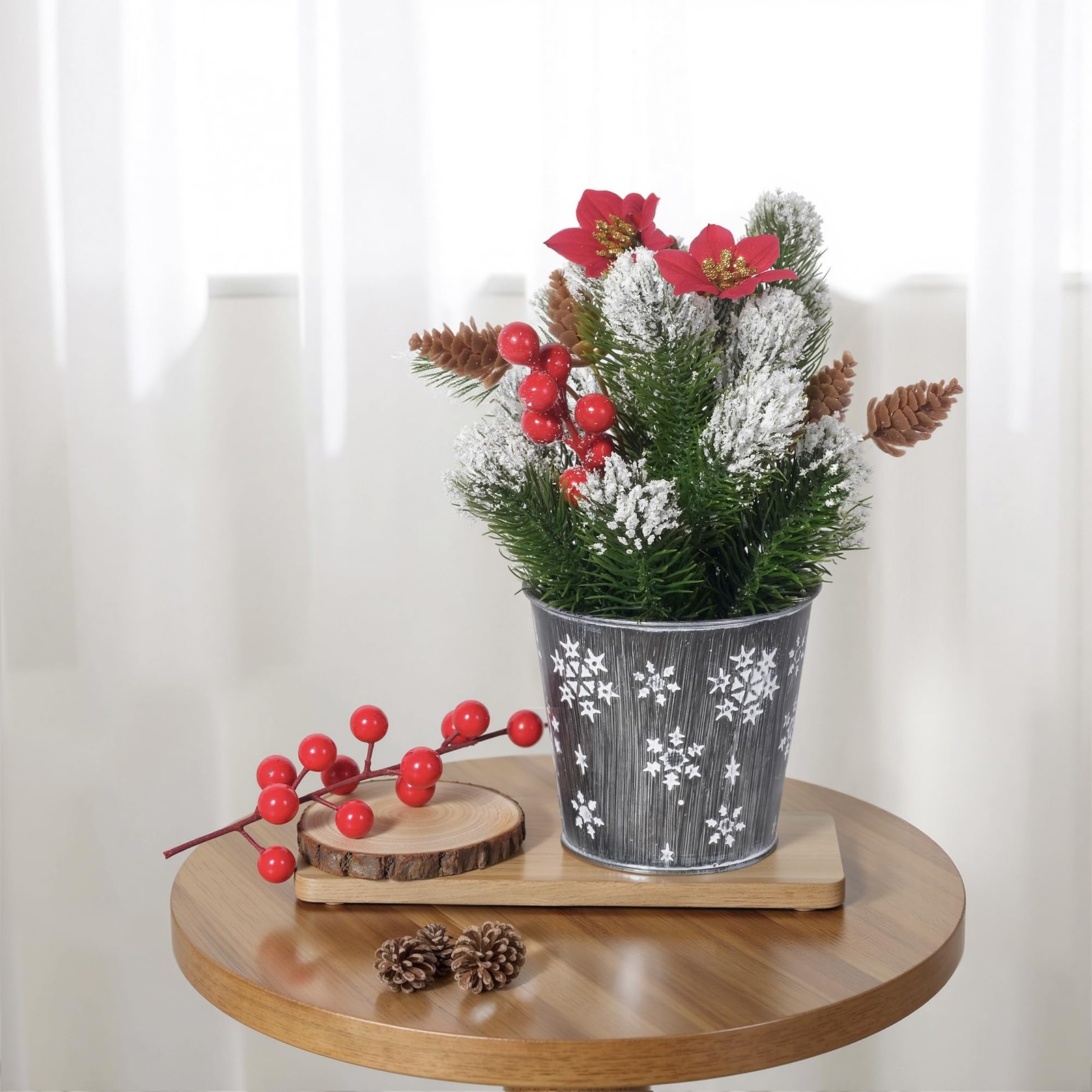 Potted Snowy Norfolk Pine Branches with Poinsettias Barries and Pin Cones