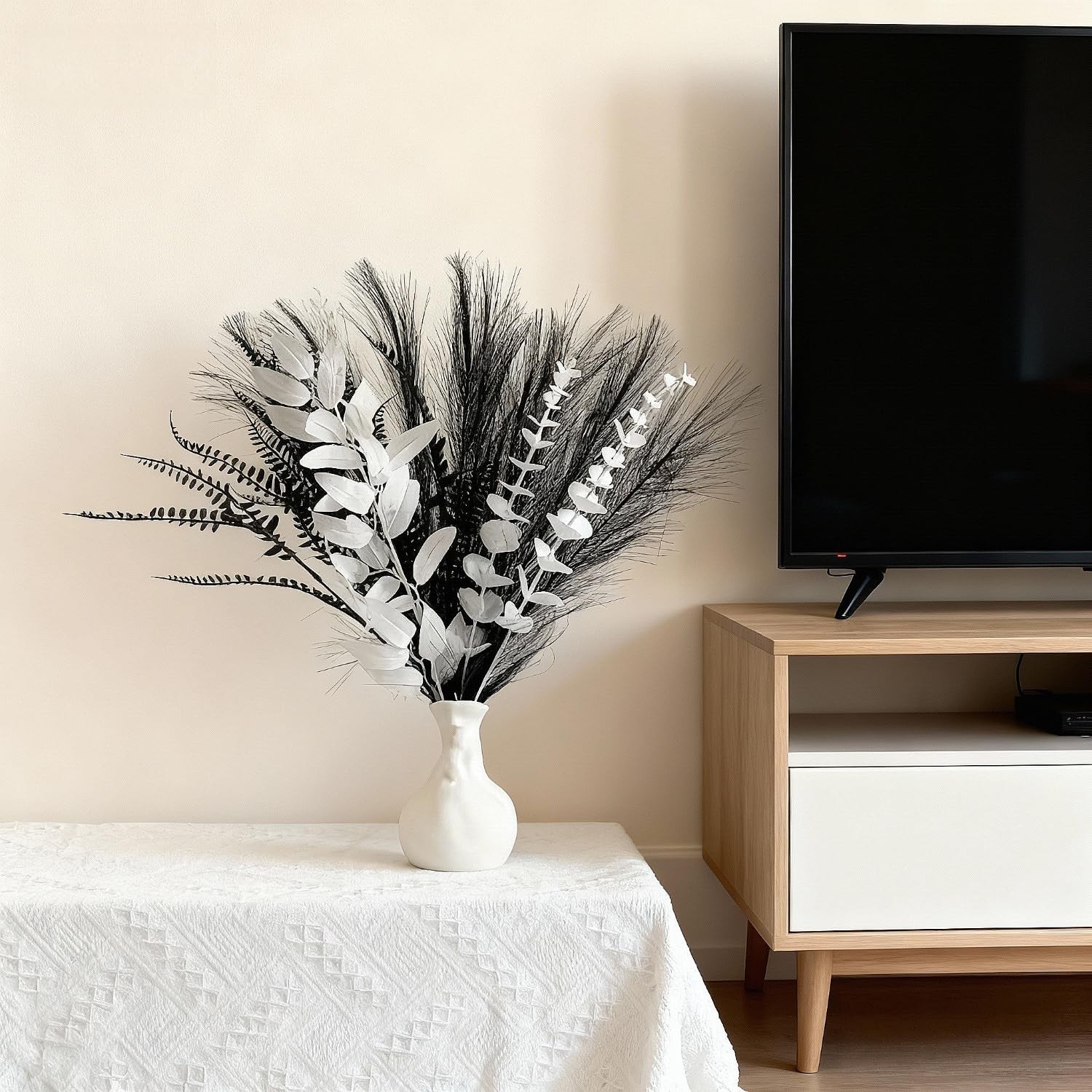 Black and white artificial bouquet in minimalist Nordic style, featuring arti…