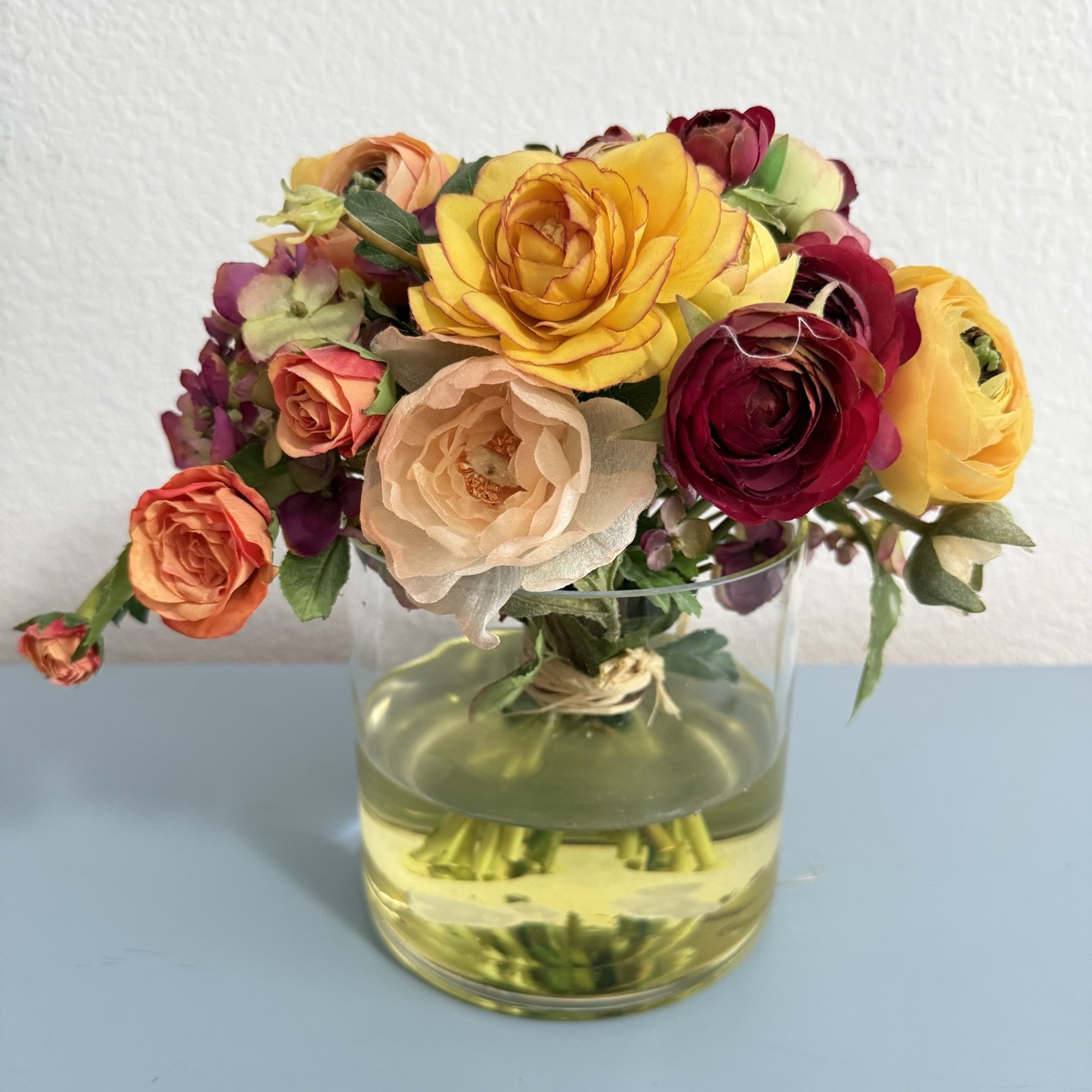 Beautiful Flower Arrangement in Glass Vase with Faux Water.