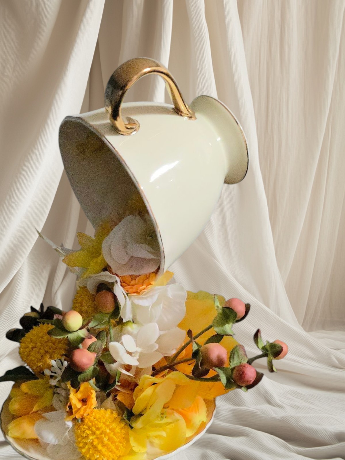Floating Tea Cup Decorated With Faux Flowers Arrangement
