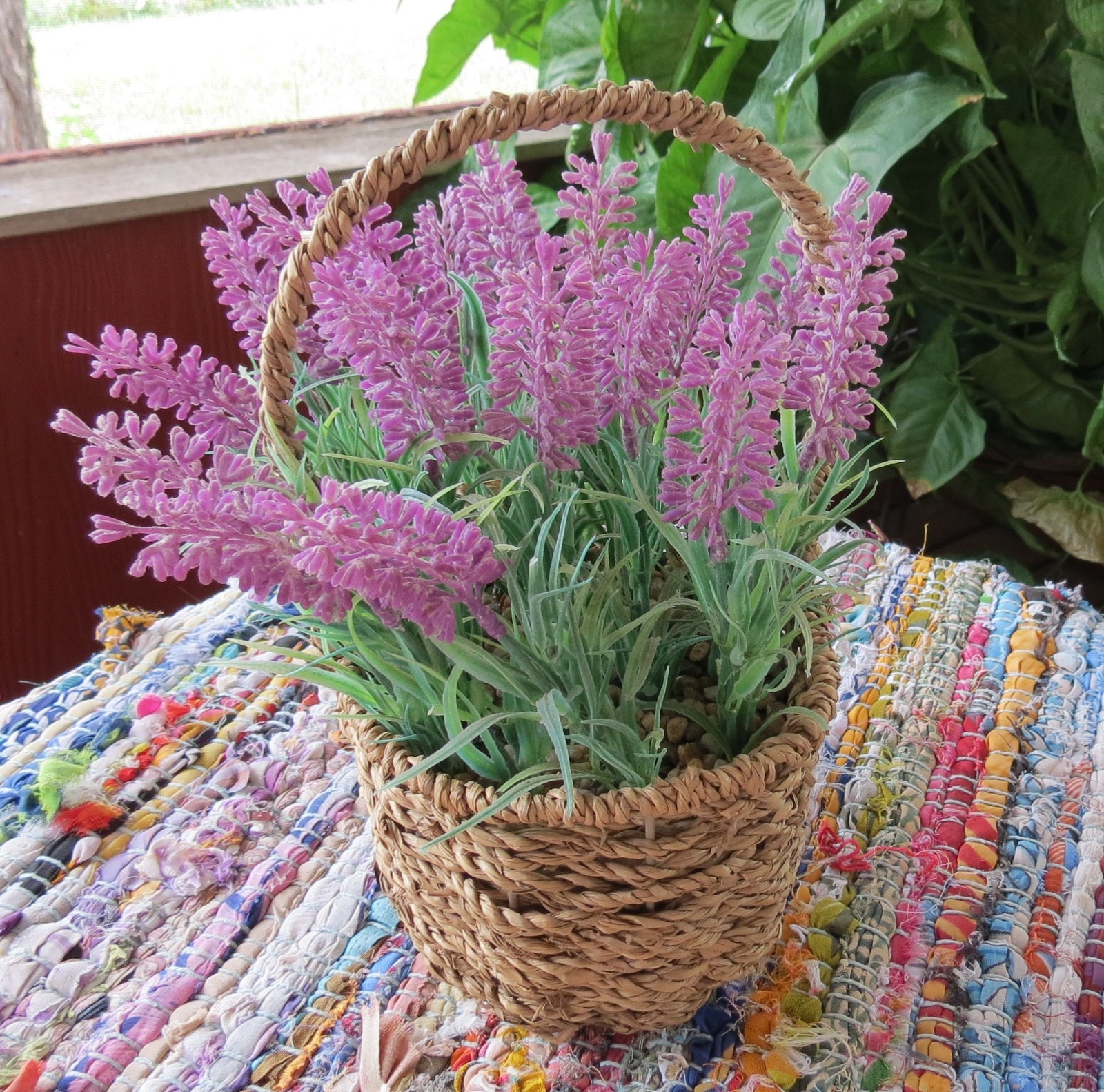 Lavender faux flowers in basket 18 ” around 4″ high 7″ wide