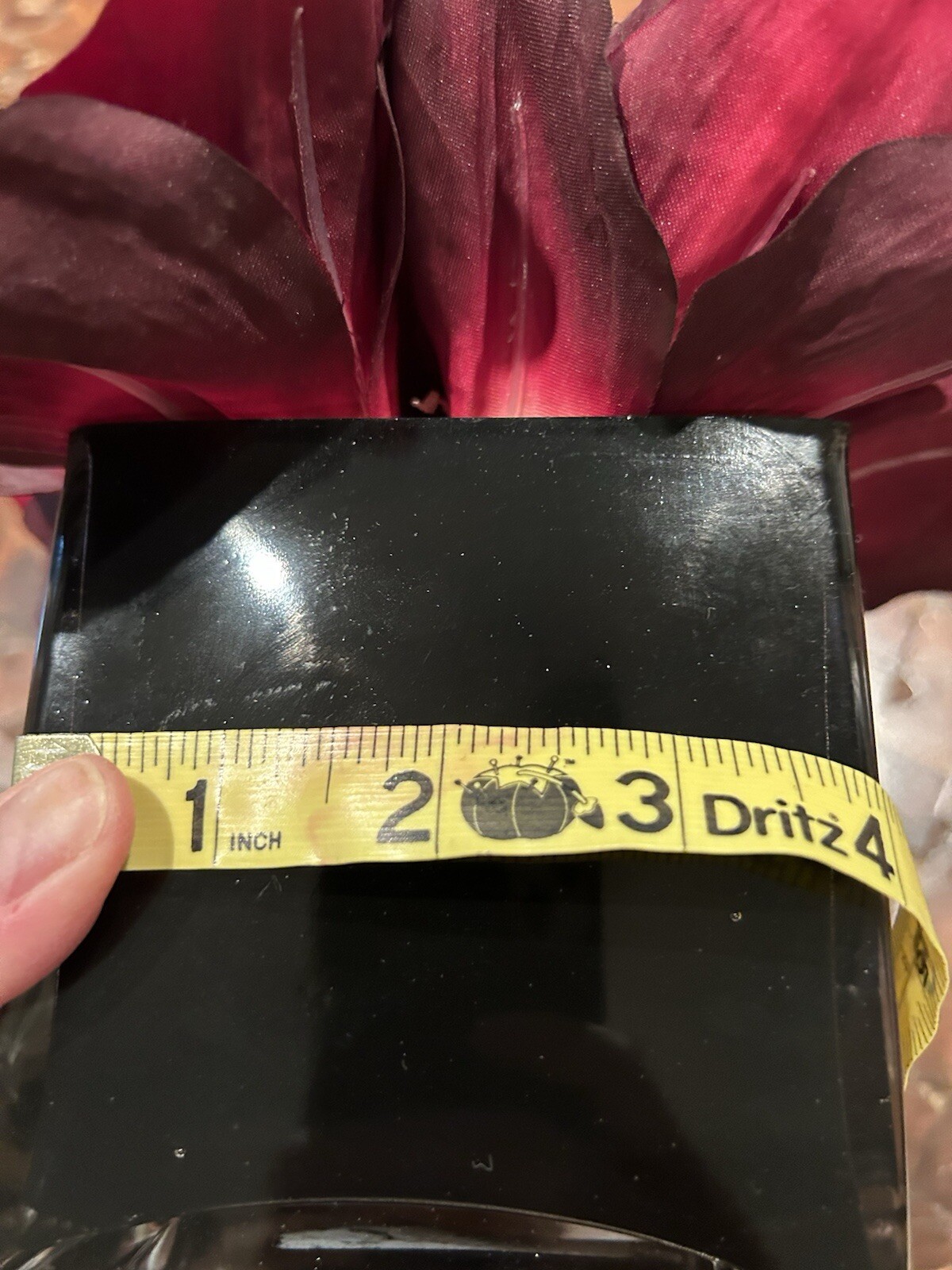 Artificial Amaryllis in Black Glass Vase