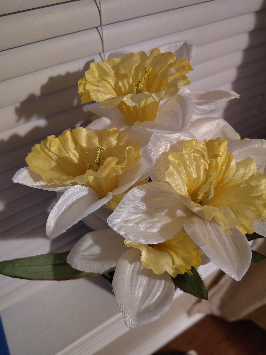 Artificial Yellow And White Daffodils In Pot With Paper