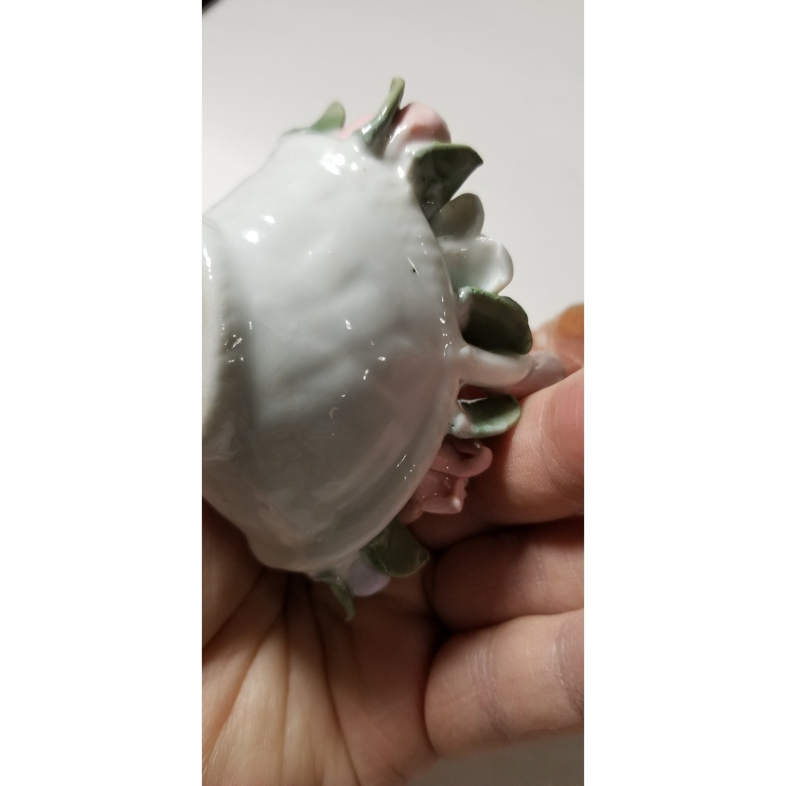 Three inch by 3 inch hand painted porcelain basket (1.1282)