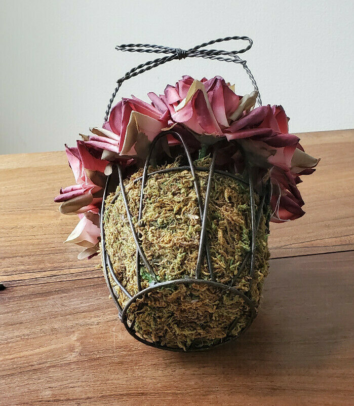 Artificial Fall Bouquet Of Roses In A Black Intertwined Wired Basket