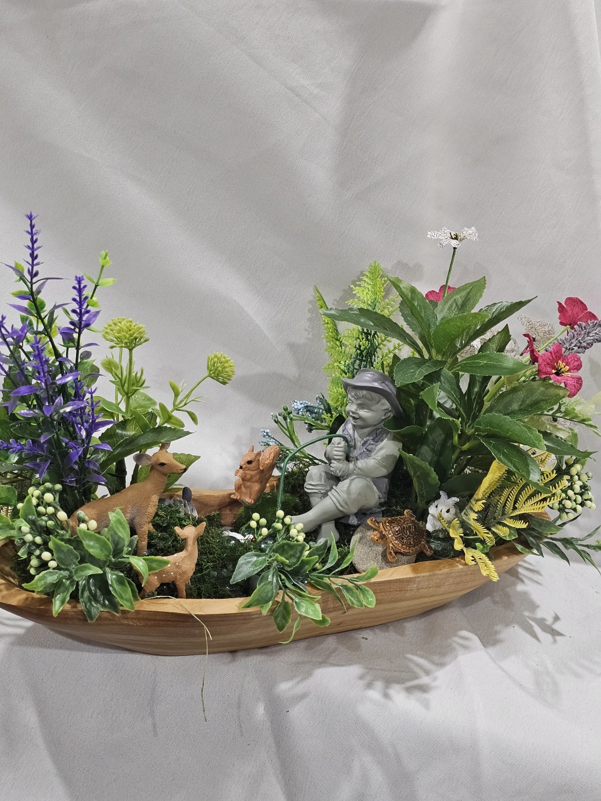 Artifical Flower Arramgement in woods, Boy Fishing Deer, Turtle Duck
