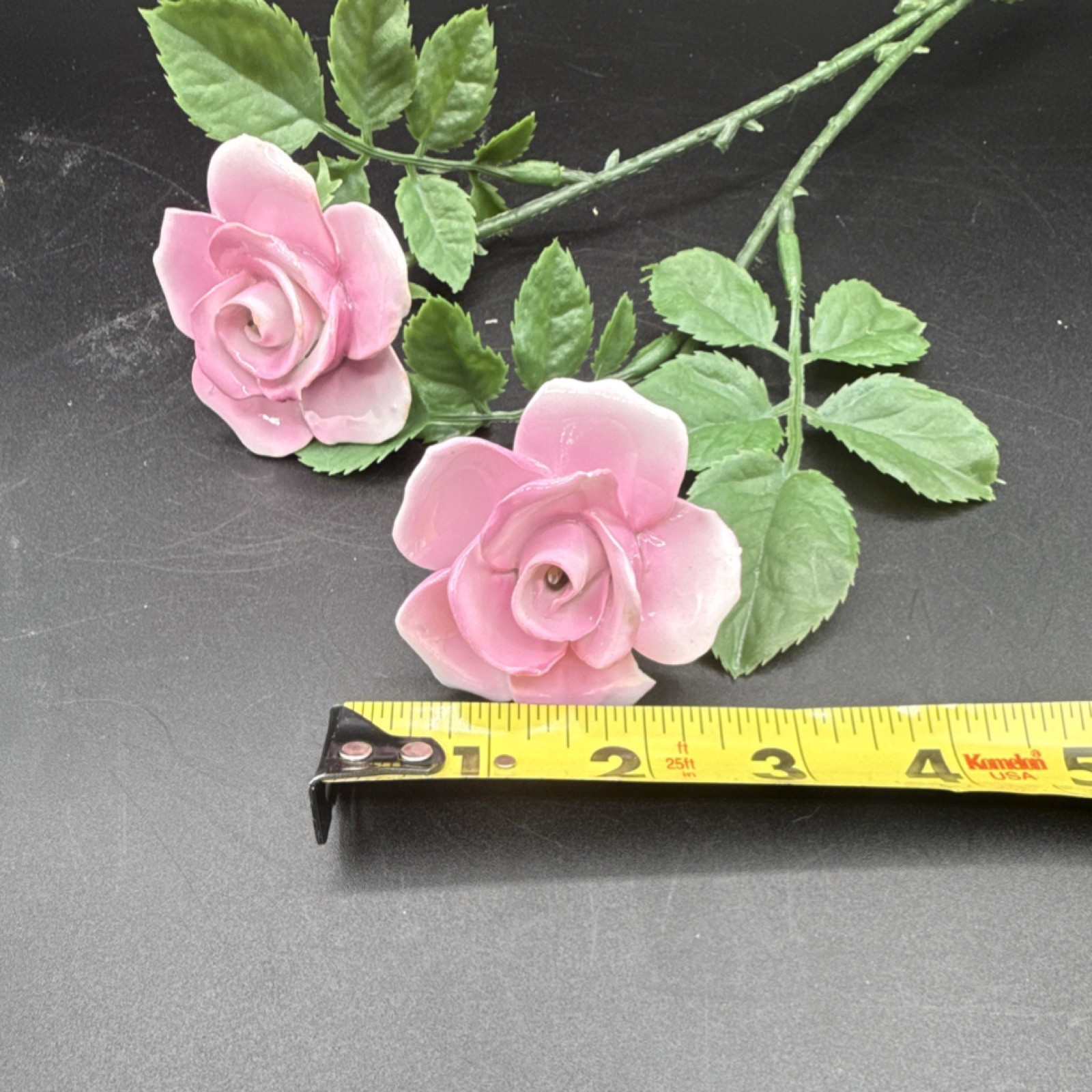 Porcelain flowers, pink roses with plastic stems and leaves