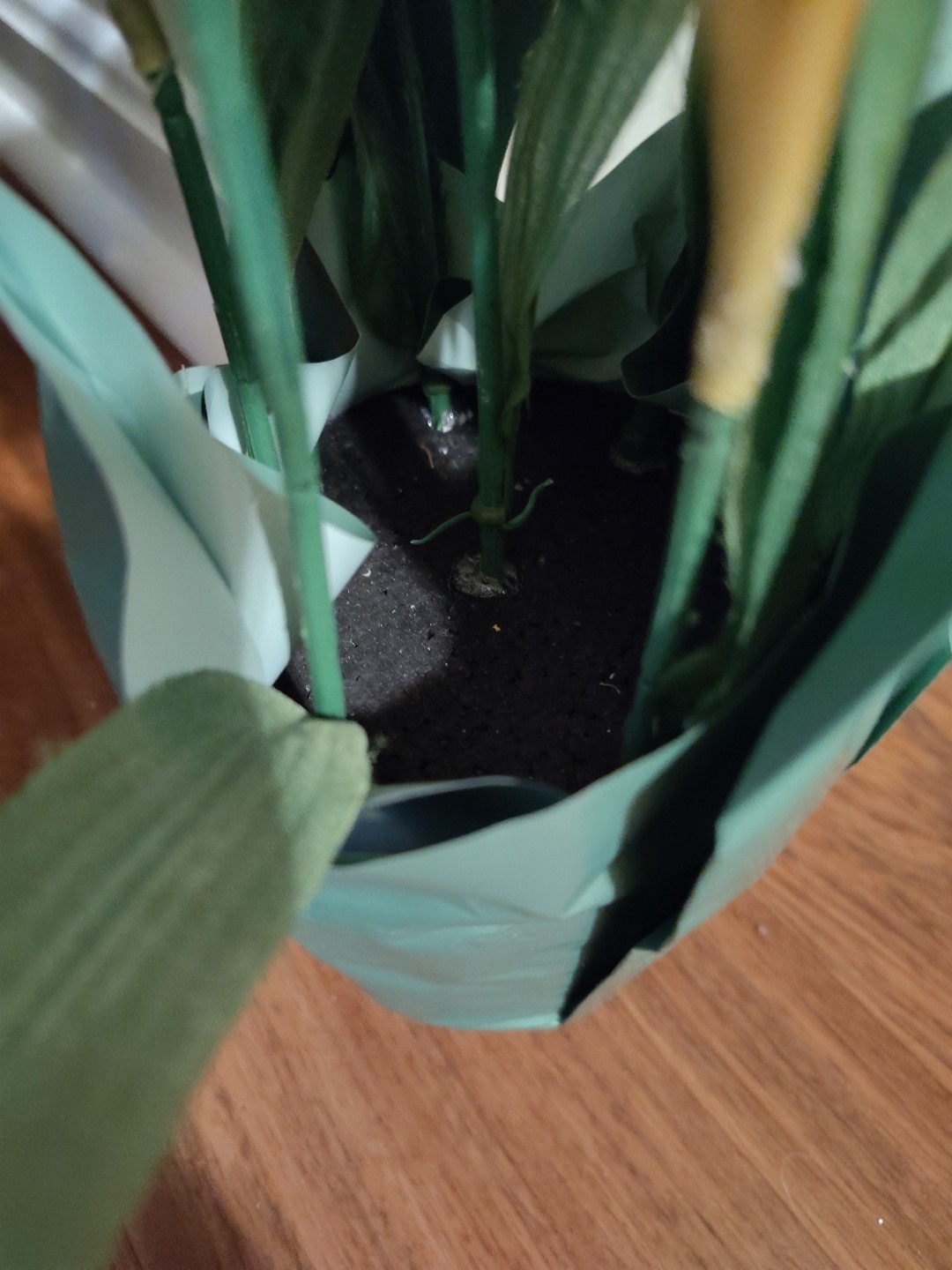 Artificial Yellow And White Daffodils In Pot With Paper