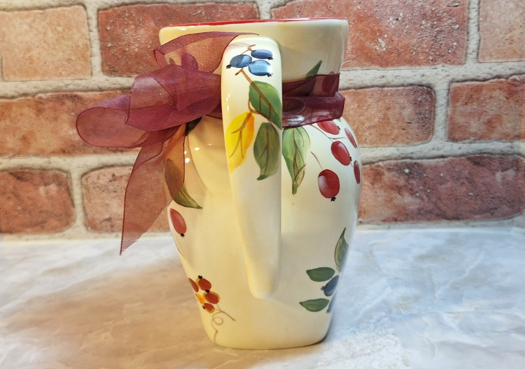Floral Arrangement Centerpiece with Red Zinnia Faux Flowers in a Grape Vine Vase
