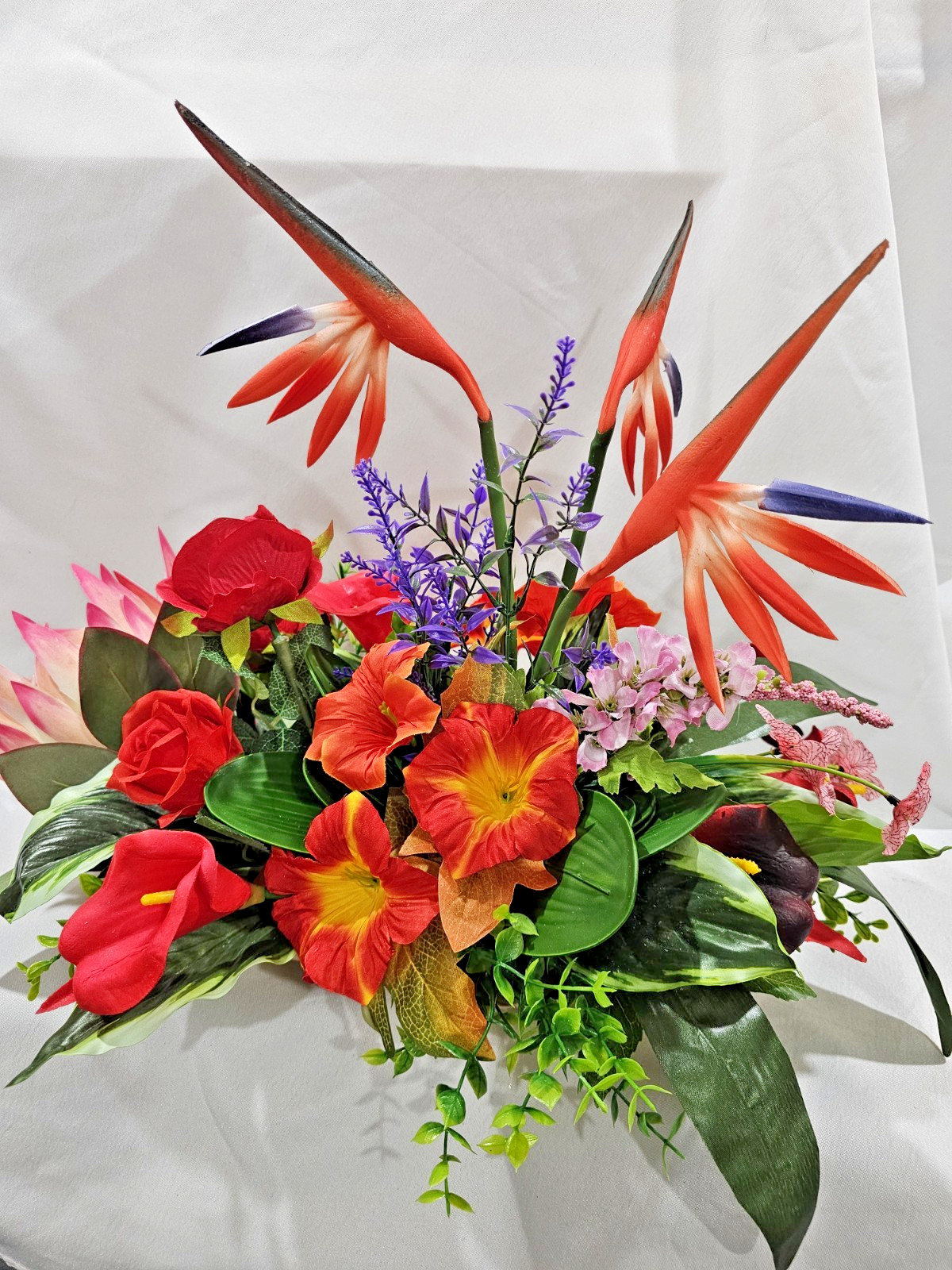 Bright Colors in this Artificial Tropical arrangement, Birds of Paradise etc.
