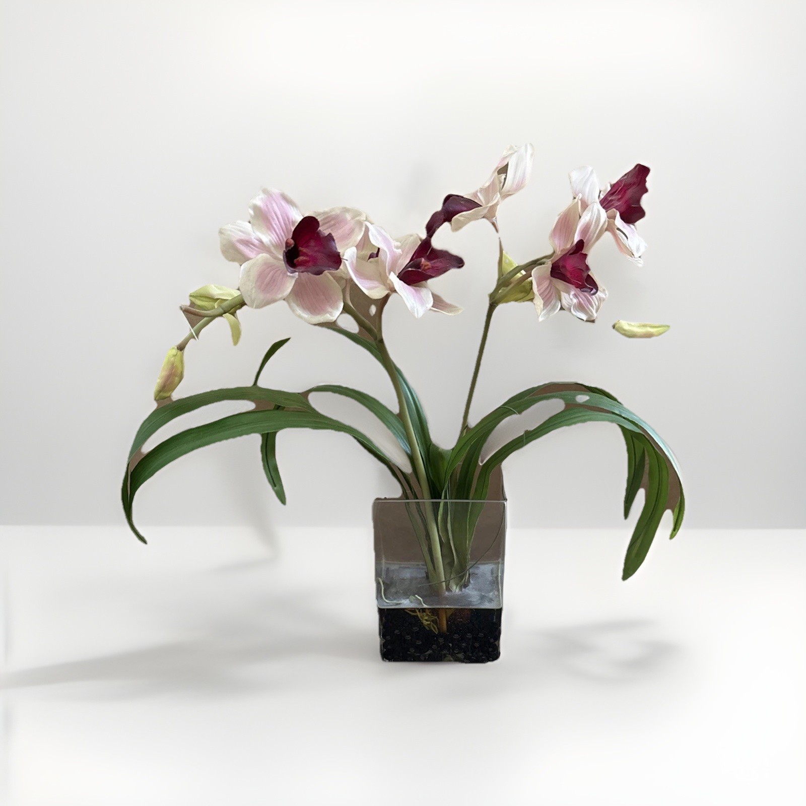 Fake Orchids In Glass Vase With Wire Inside Leaves For Posing