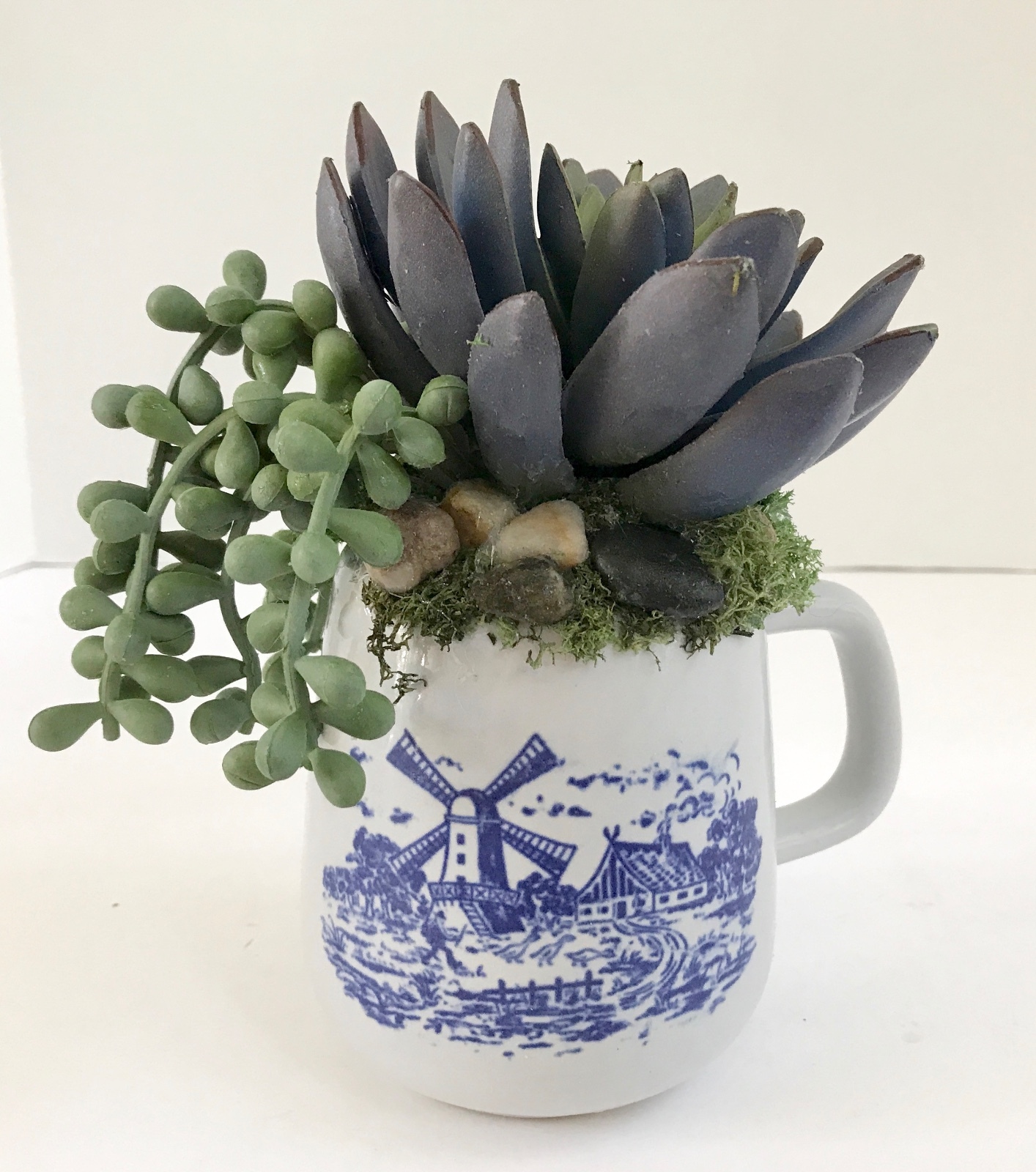 Decorative Artificial Purple and Green Grass Succulents in a Blue and White Mug
