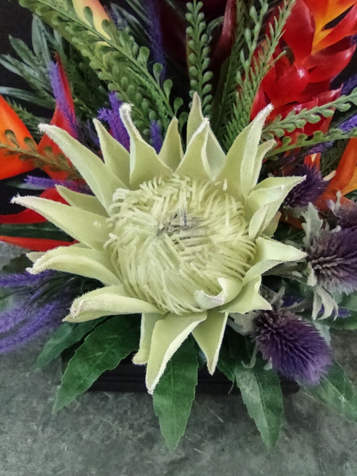Artificia ltropical floral arrangement