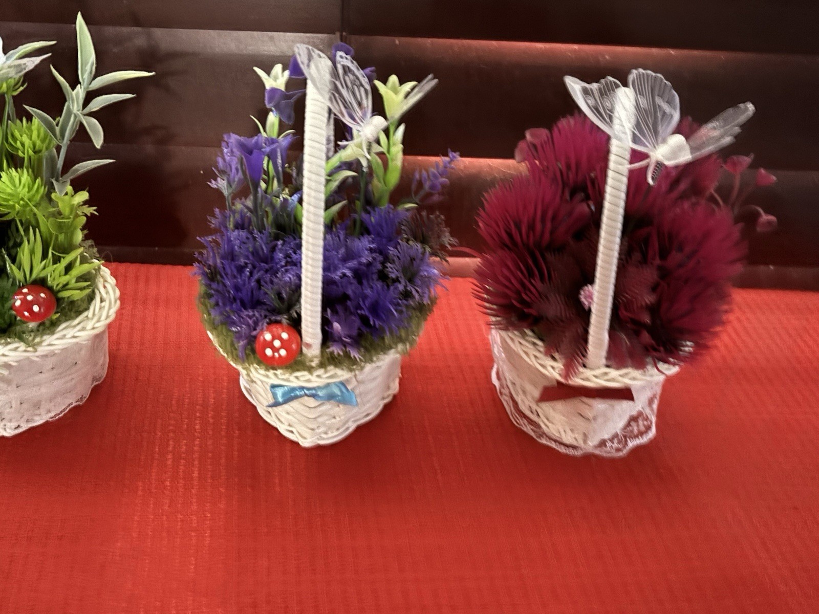 Artificial Floral Arrangement in White Wicker Baskets, Butterfly Accent