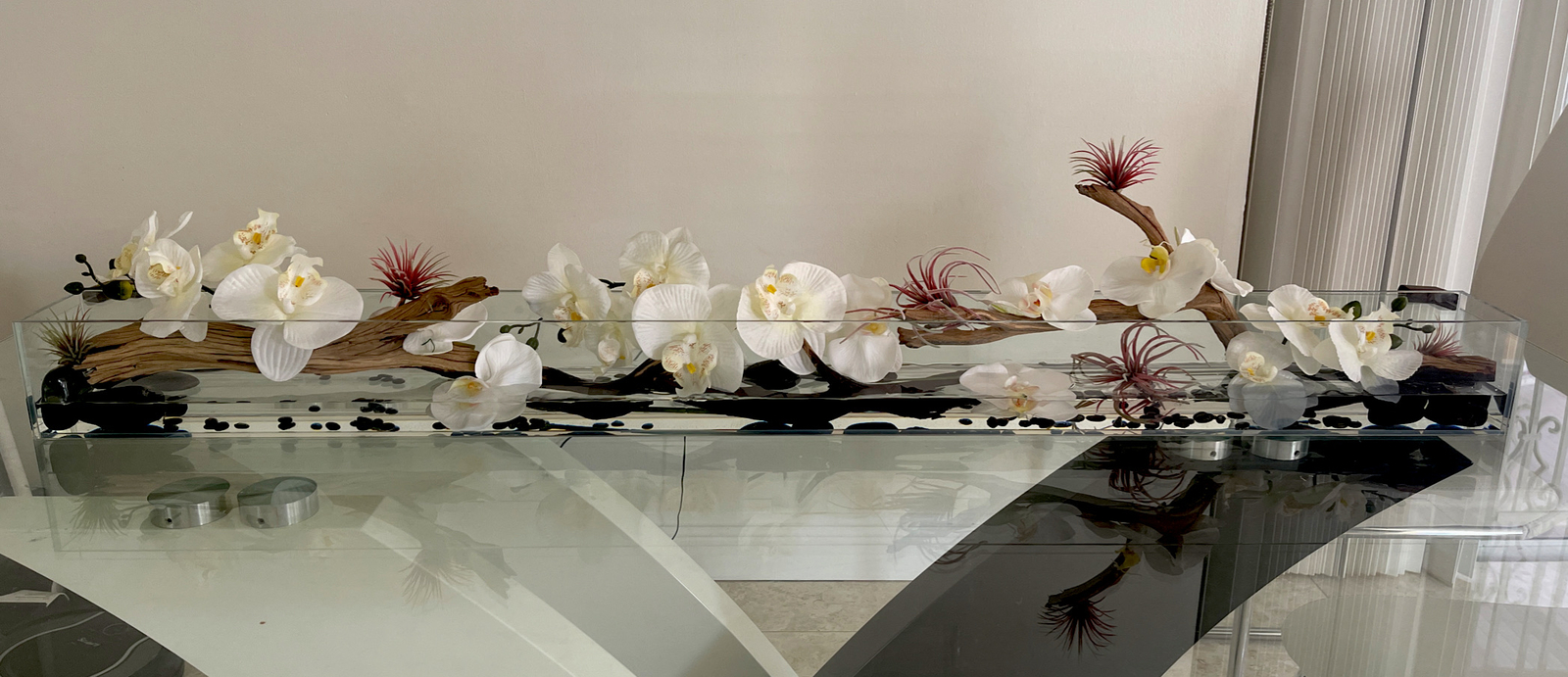 Silk orchid floral arrangement in rectangular glass vaseorchids arrangements48”