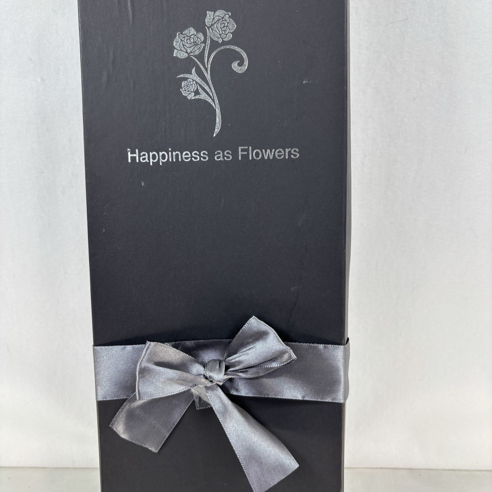Gold-plated artificial rose bouquet in a black gift box