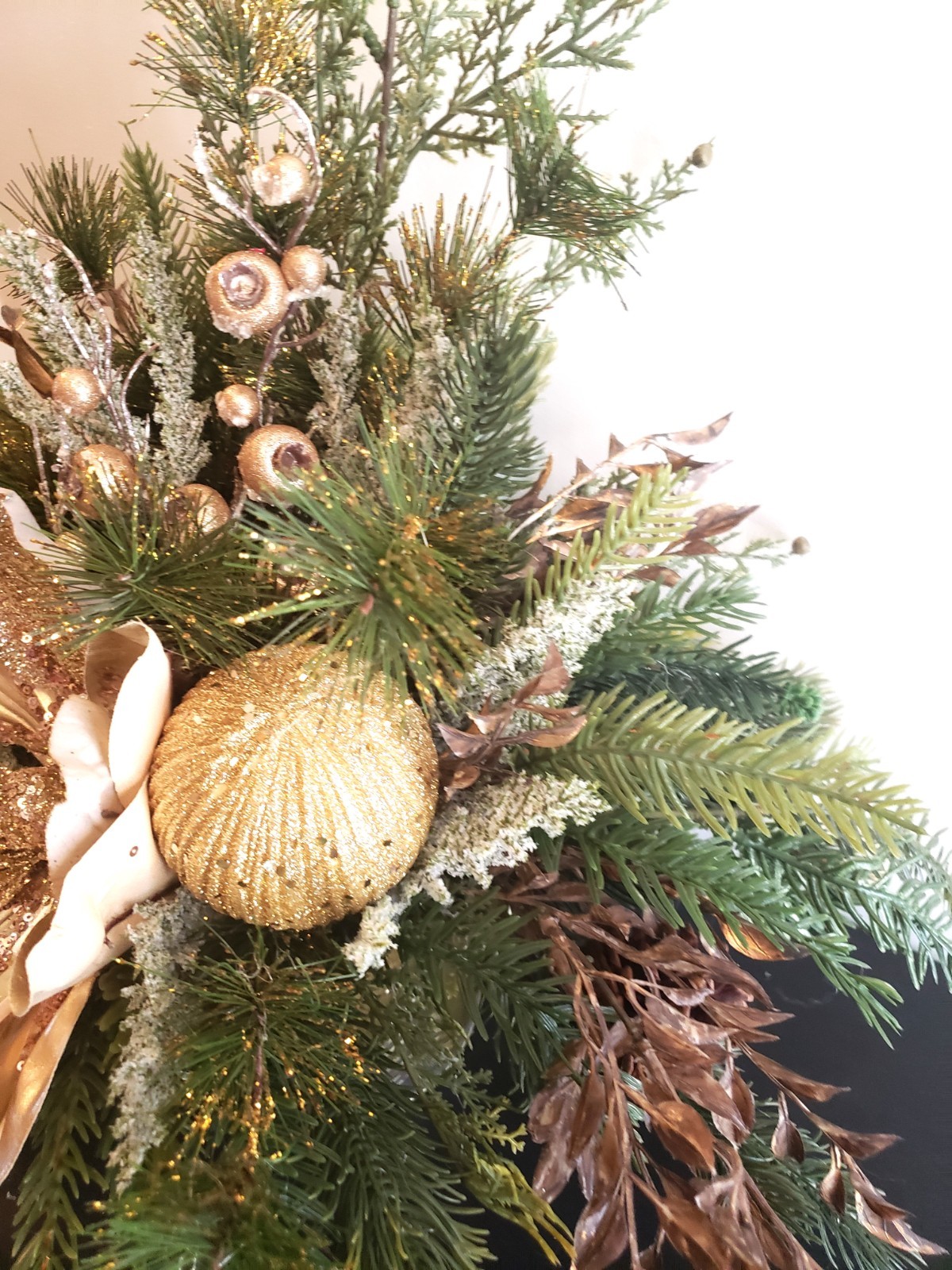 Gold magnolia Christmas floral arrangement, holiday floral arrangement