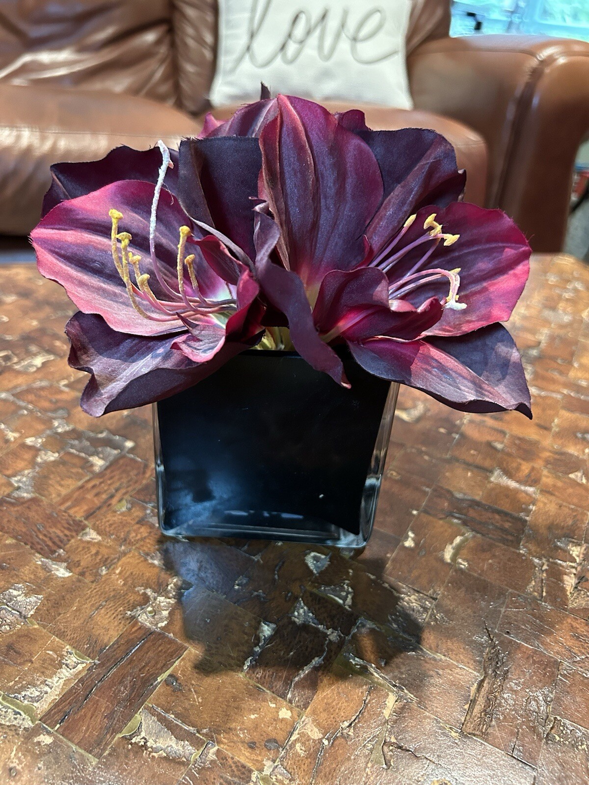 Artificial Amaryllis in Black Glass Vase