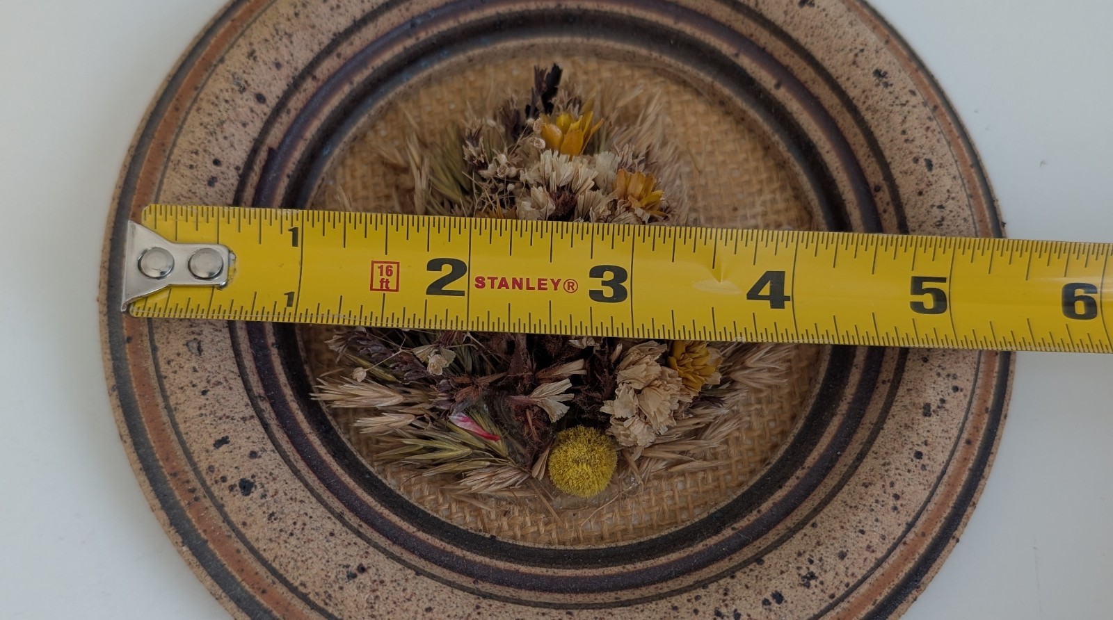 Dried flowers wall hanging round pottery circle speckled floral art boho fall