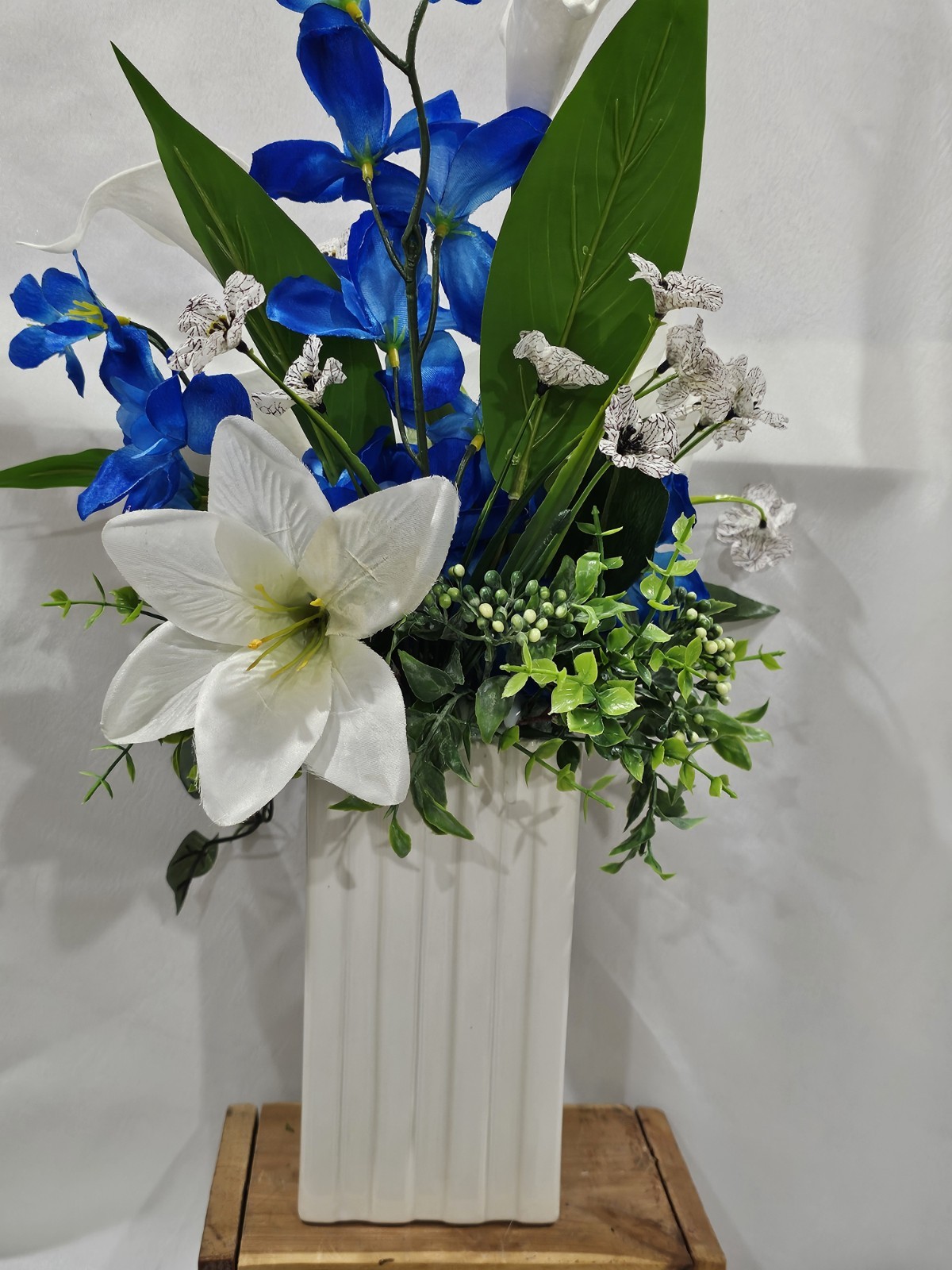 Blue with White Lilies Flower Arrangement Lush green & white ceramic vase